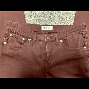 Madewell rust colored skinny jeans.